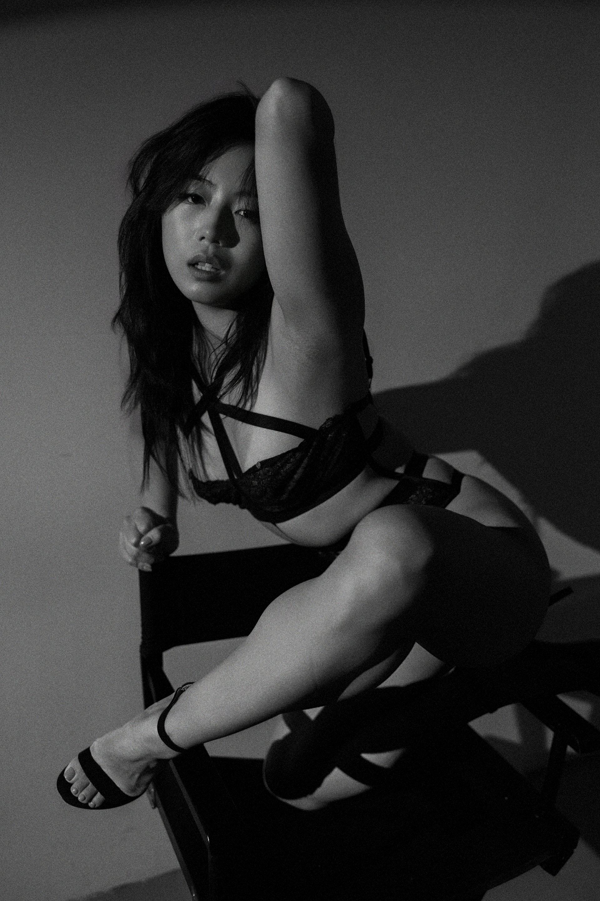 NYC model Minnie Lee posing in black and white lingerie editorial — showcasing expressive form, refined sensuality, and sculptural elegance. Captured by Orion Mckinley Phillips II., highlighting expert posing and timeless beauty.