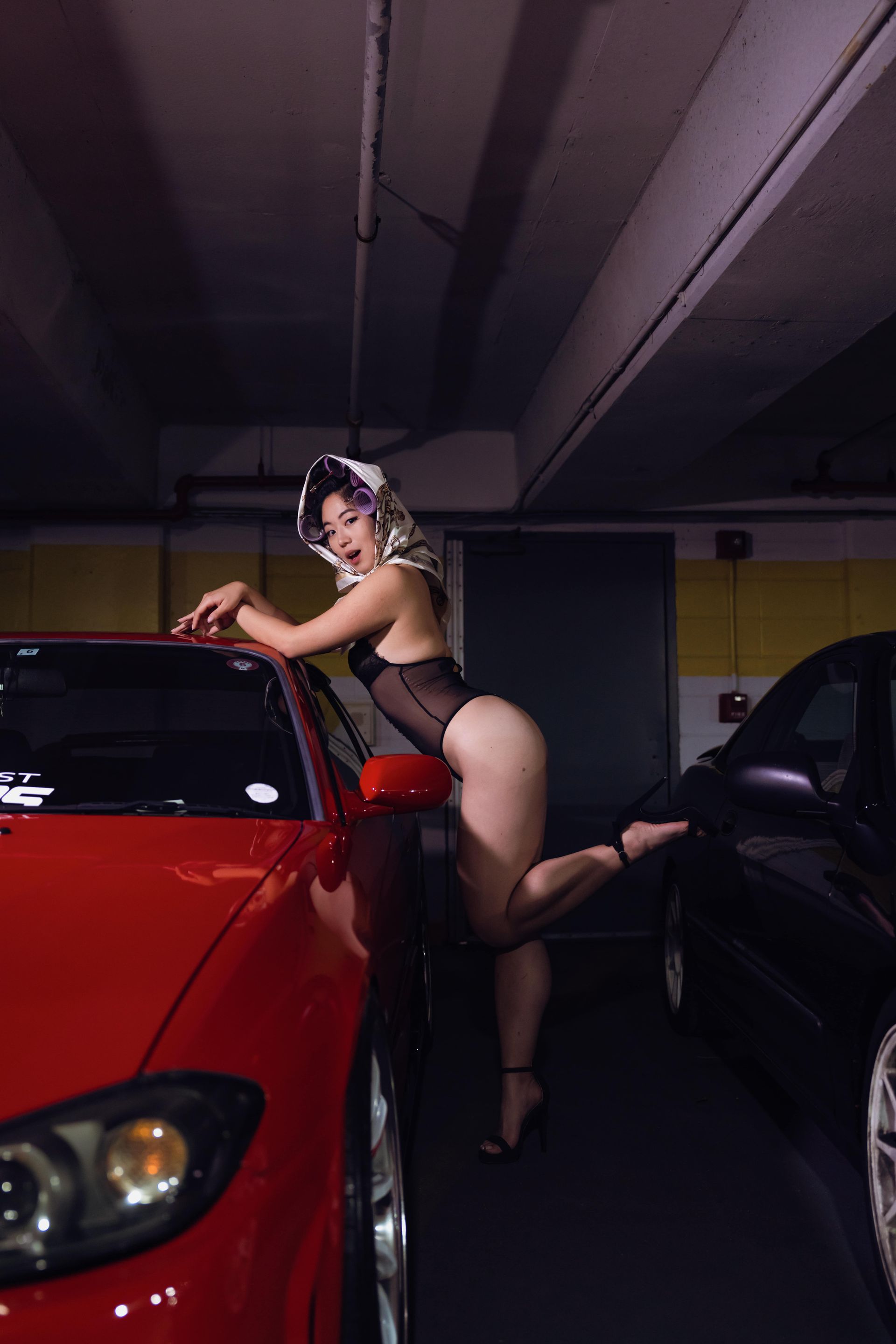 Editorial lingerie portrait referencing classic automotive pin-up imagery