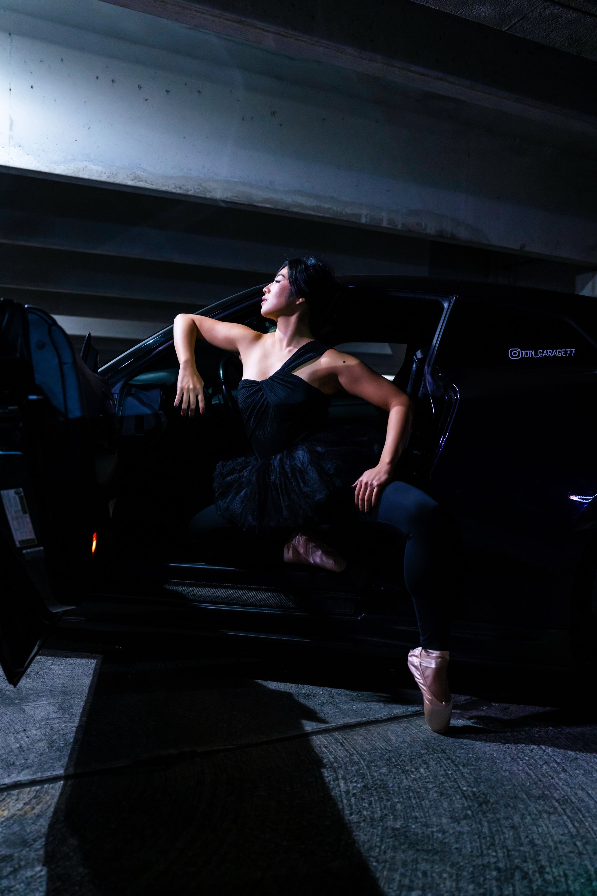 Model Minnie Lee performing ballet on pointe beside a Nissan GTR at the Checkm8 private car meet, photographed by Josanna Uy in NYC.