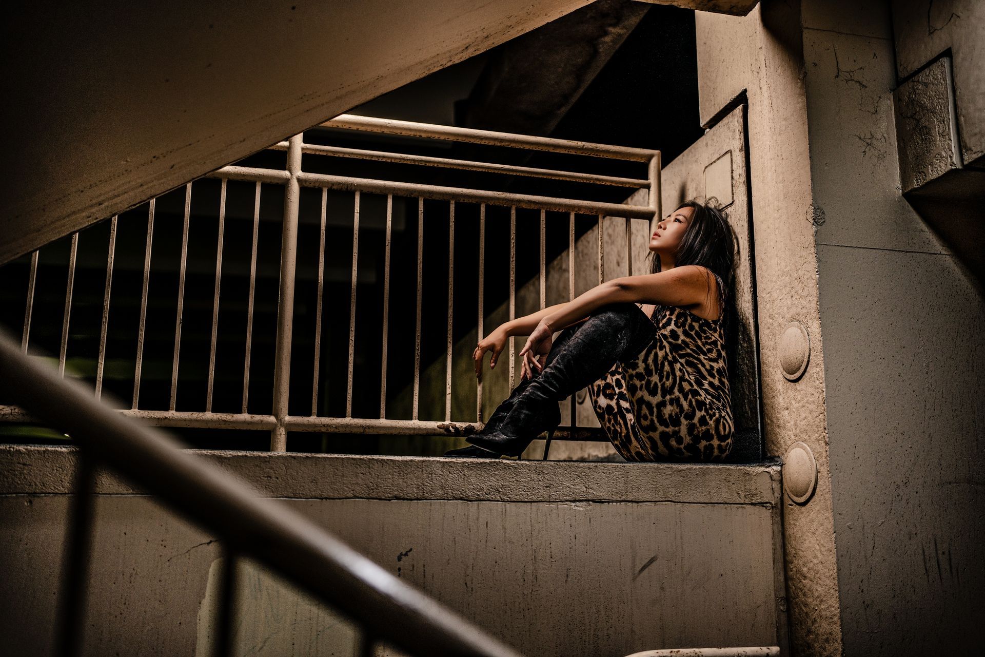 NYC model Minnie Lee in leopard print dress and black boots.