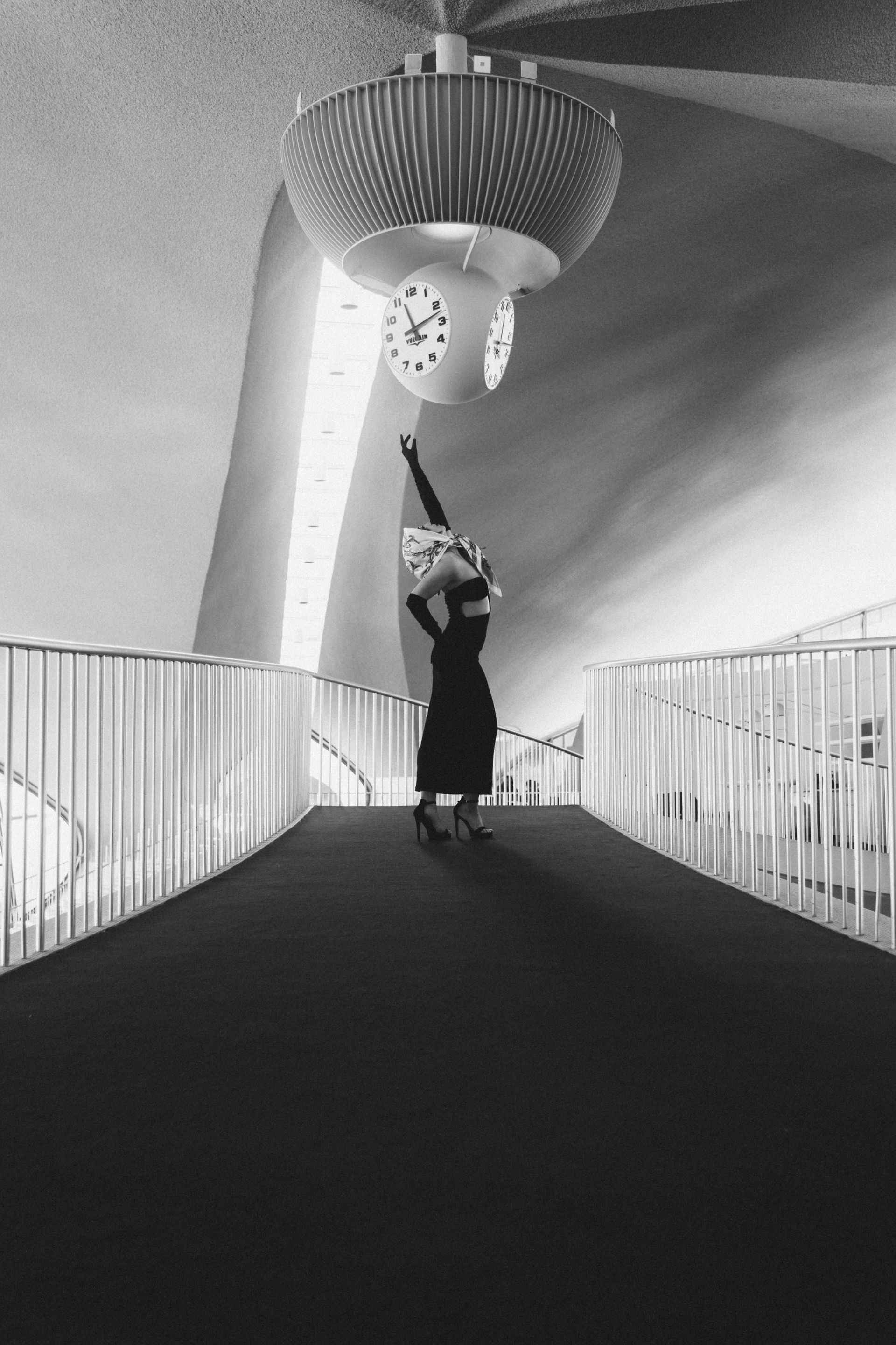 Luxury editorial photography with refined dramatic pose 