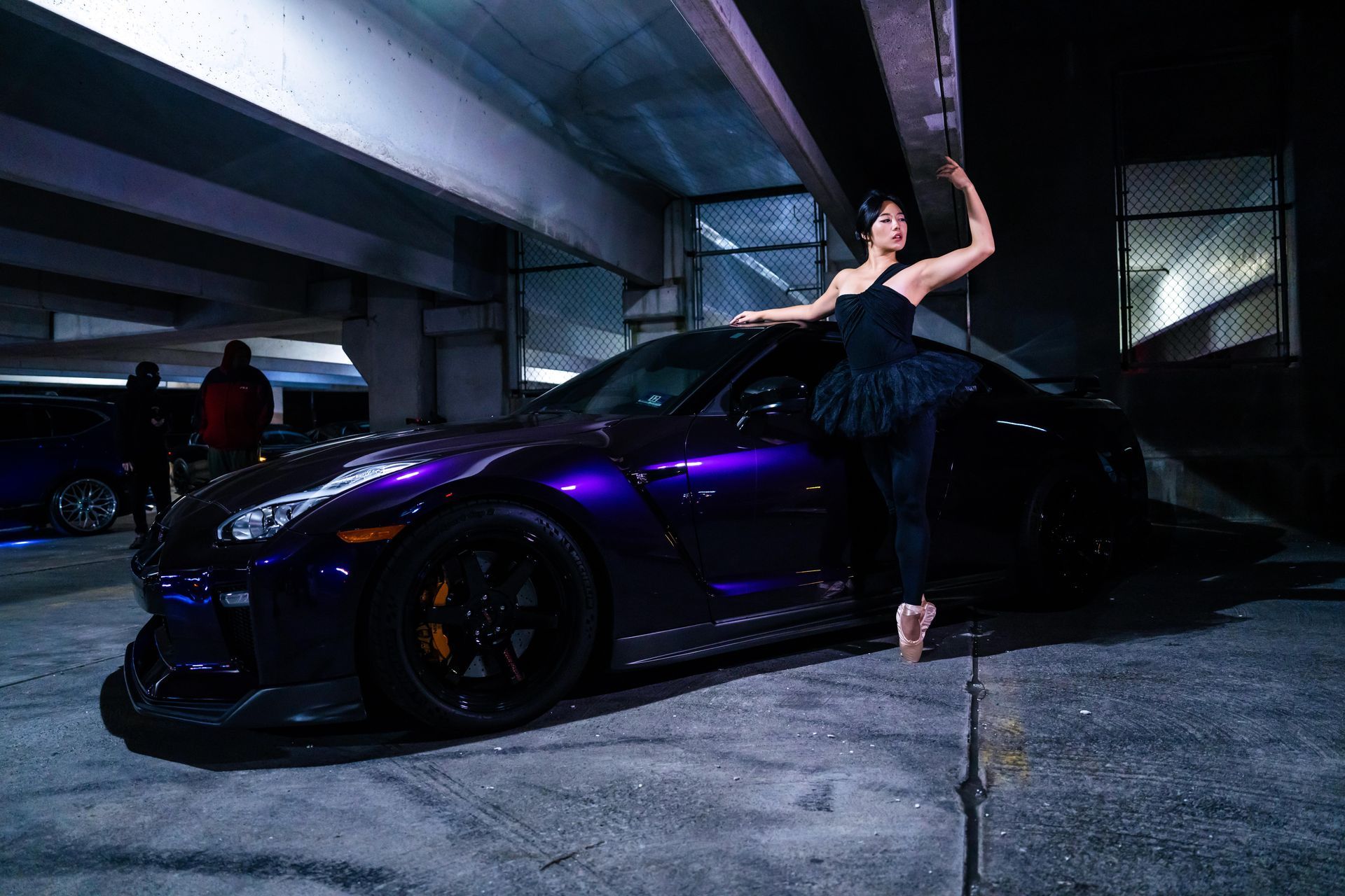 Model Minnie Lee performing ballet on pointe beside a Nissan GTR at the Checkm8 private car meet, photographed by Josanna Uy in NYC.