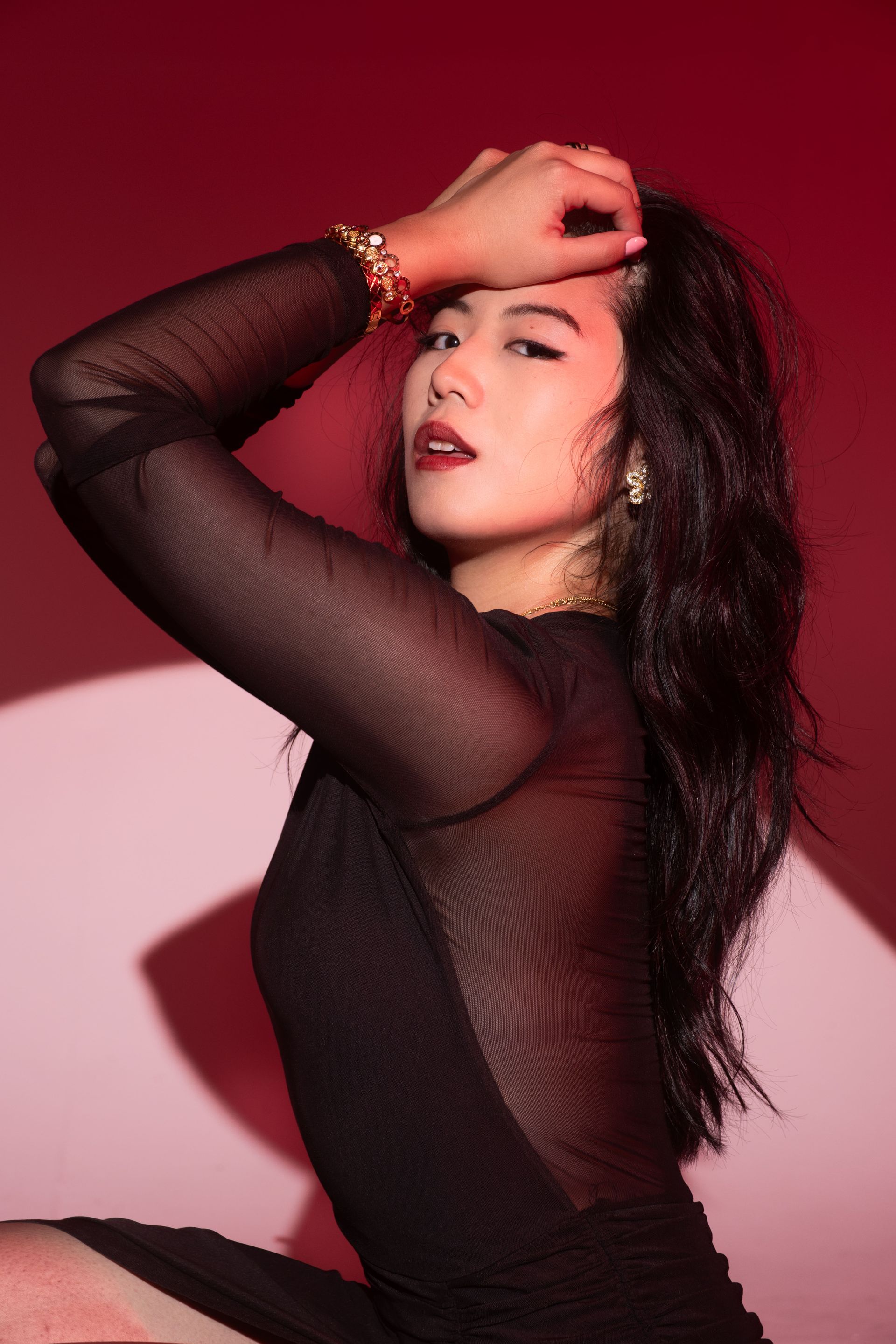 Woman leaning on car on One Life car rally. Black and white. Luxury car model