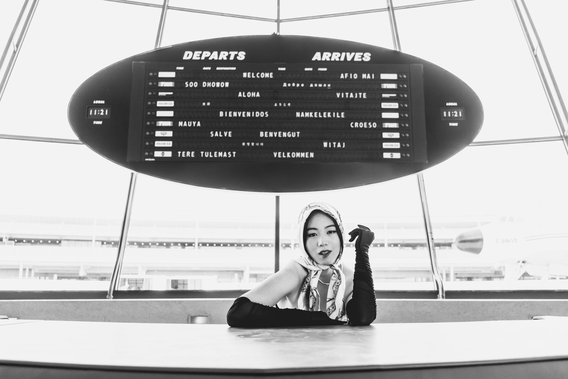 Editorial fashion portrait by Minnie Lee, photographed at the TWA Hotel dashboard
