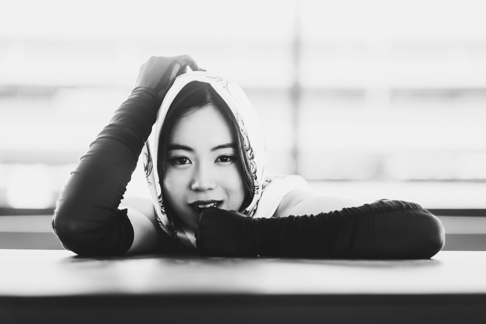 Editorial retro black and white fashion portrait by Minnie Lee, photographed at the TWA Hotel dashboard