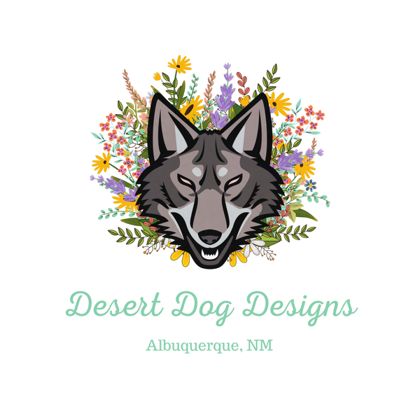 Logo for Desert Dog Designs in Albuquerque, NM, featuring a gray wolf head centered amidst a colorful floral bouquet.