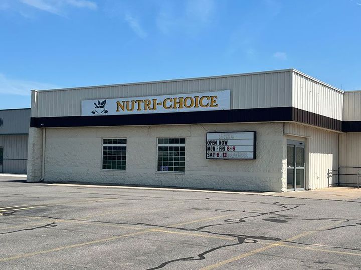 A white building with a sign that says nutri-choice