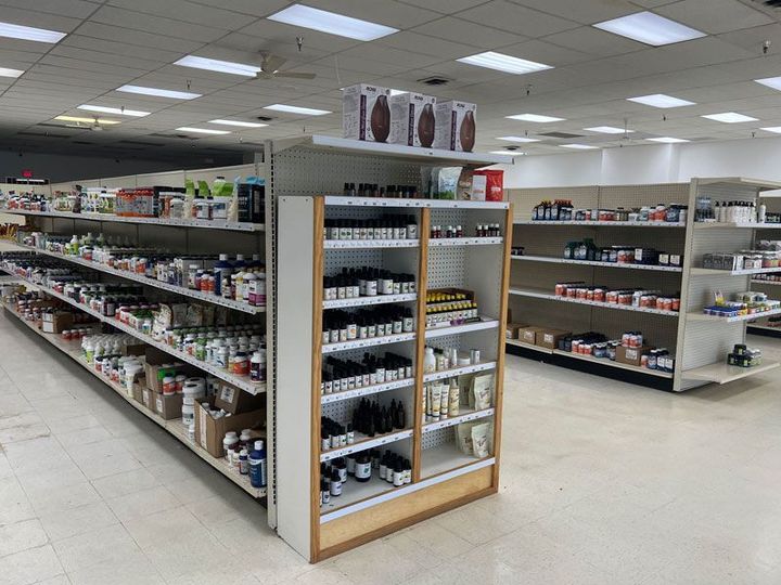 A pharmacy with a lot of shelves filled with lots of products