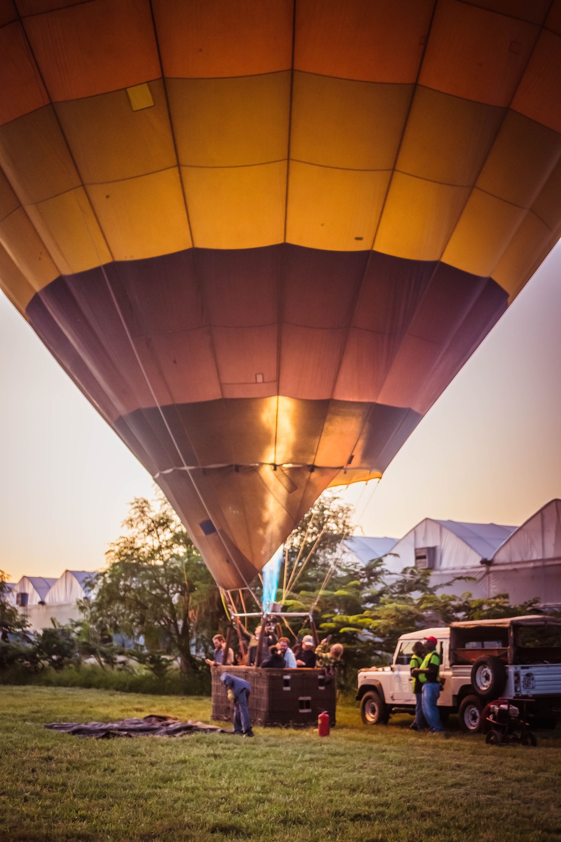 A hot air balloon is being loaded with people