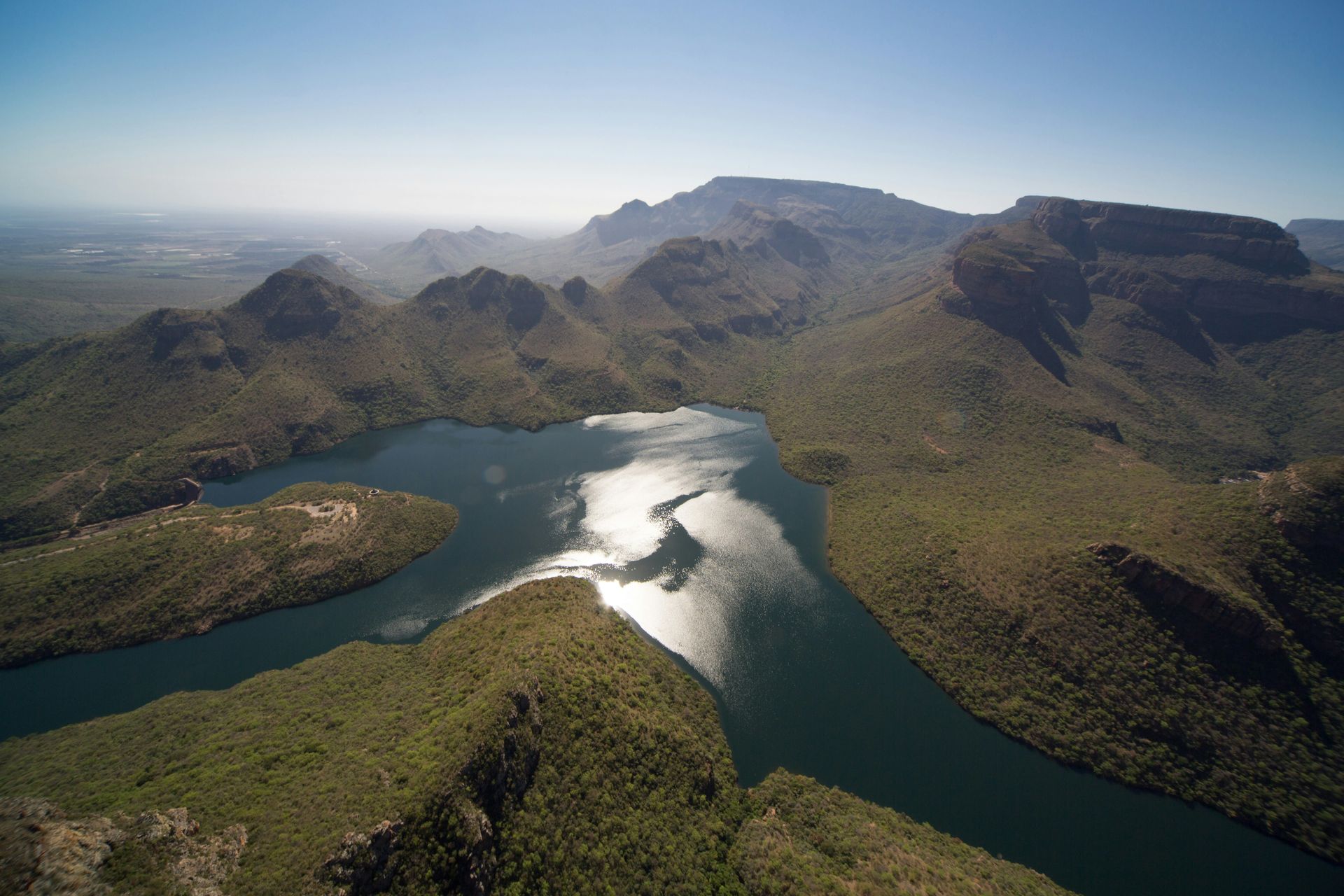 An aerial view of a river surrounded by mountains