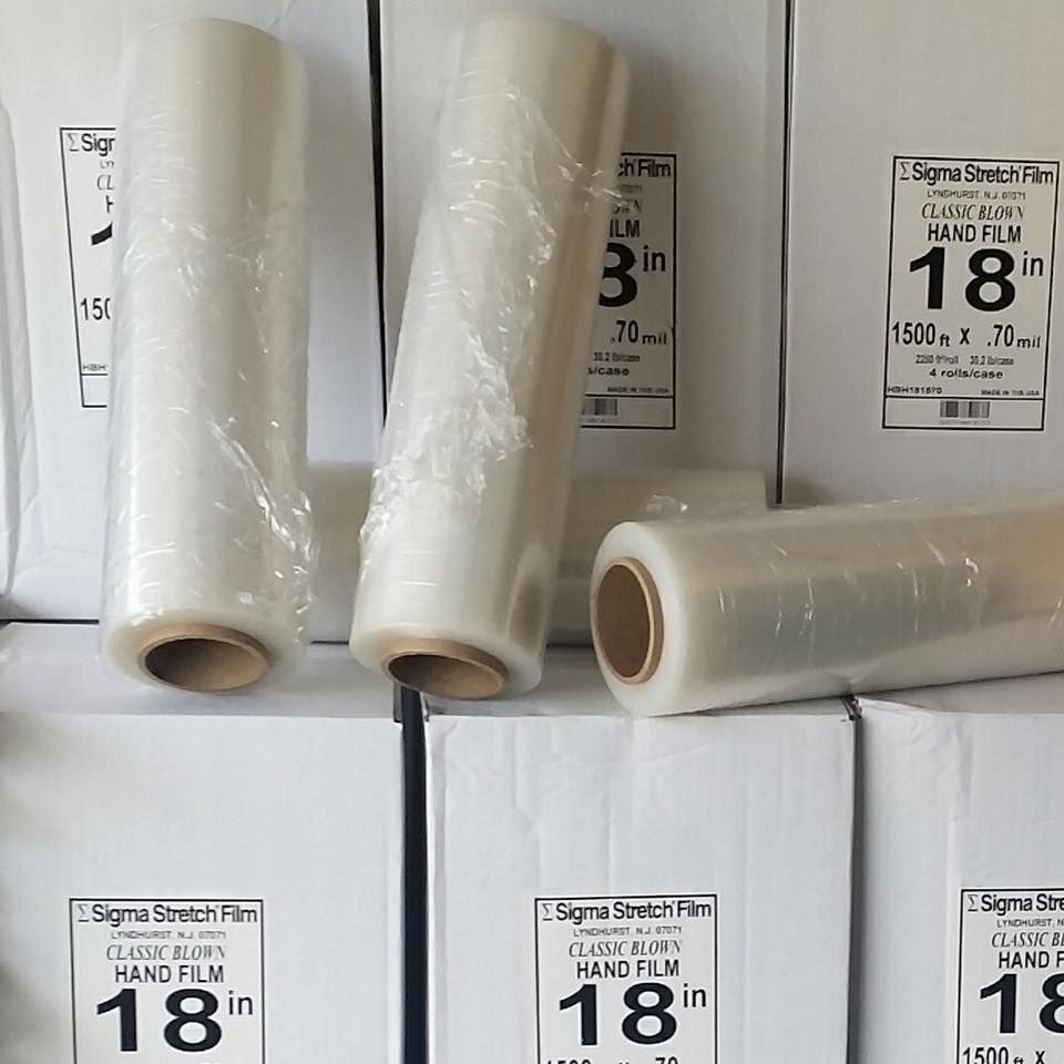 Several rolls of sigma stretch film are stacked on top of each other