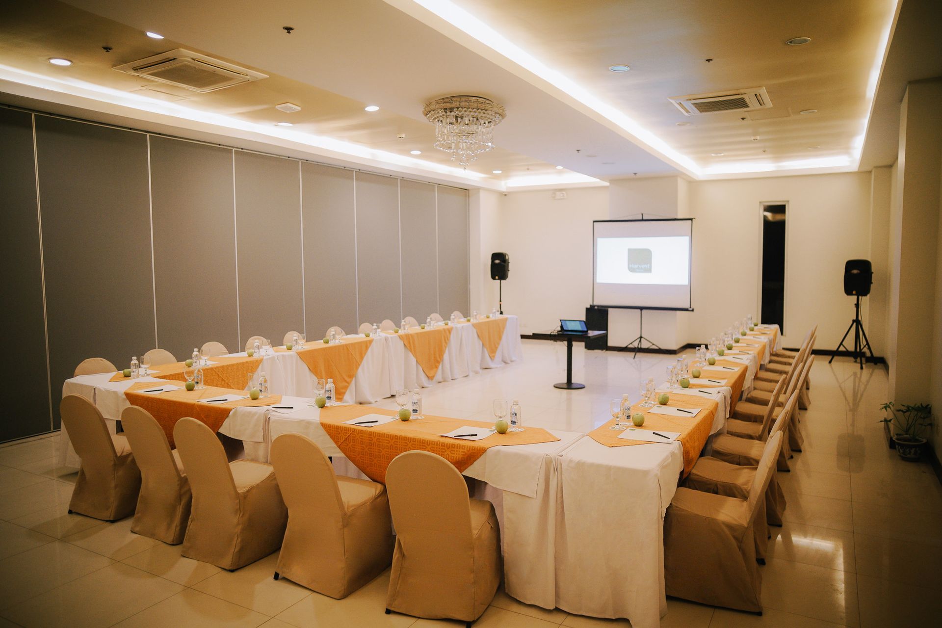 A large conference room with tables and chairs set up for a meeting.