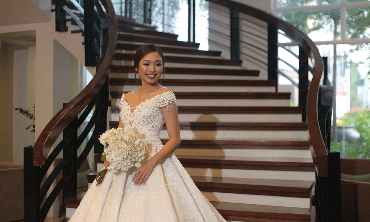 Bride at Cabanatuan wedding venue stairs