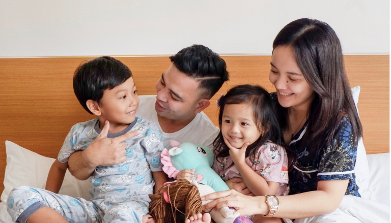 Happy family bonding in a cozy hotel room at Harvest Hotel Cabanatuan