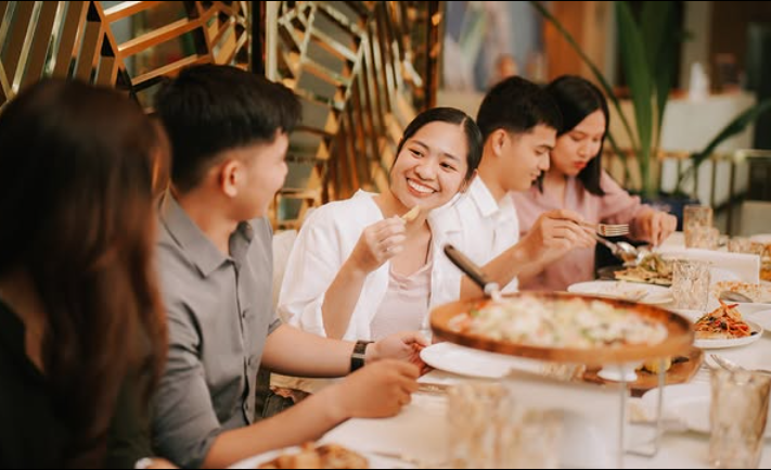 A team collaborating in a meeting, representing the excellent group booking and conference options at Harvest Hotel in Cabanatuan.