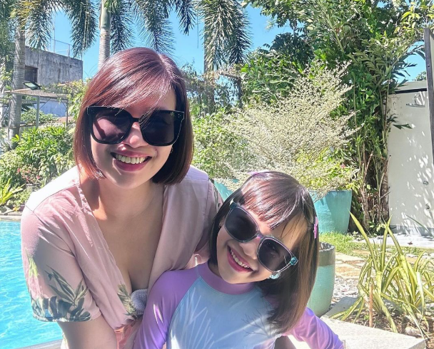 A mother and daughter enjoying a family-friendly stay, highlighting how Harvest Hotel supports work-life balance for business accommodation.