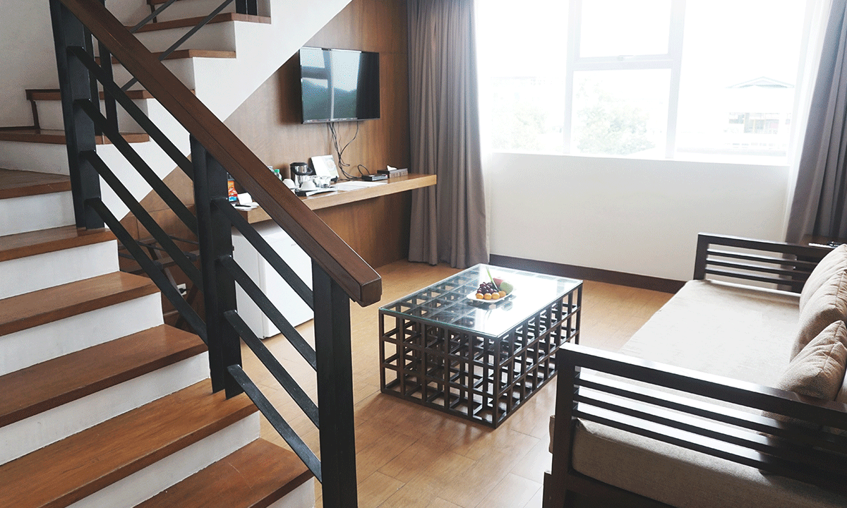 The spacious two-level Loft Suite at Harvest Hotel, a premium business accommodation choice for extended stays.
