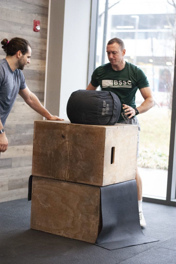 Partner workout with sandbag