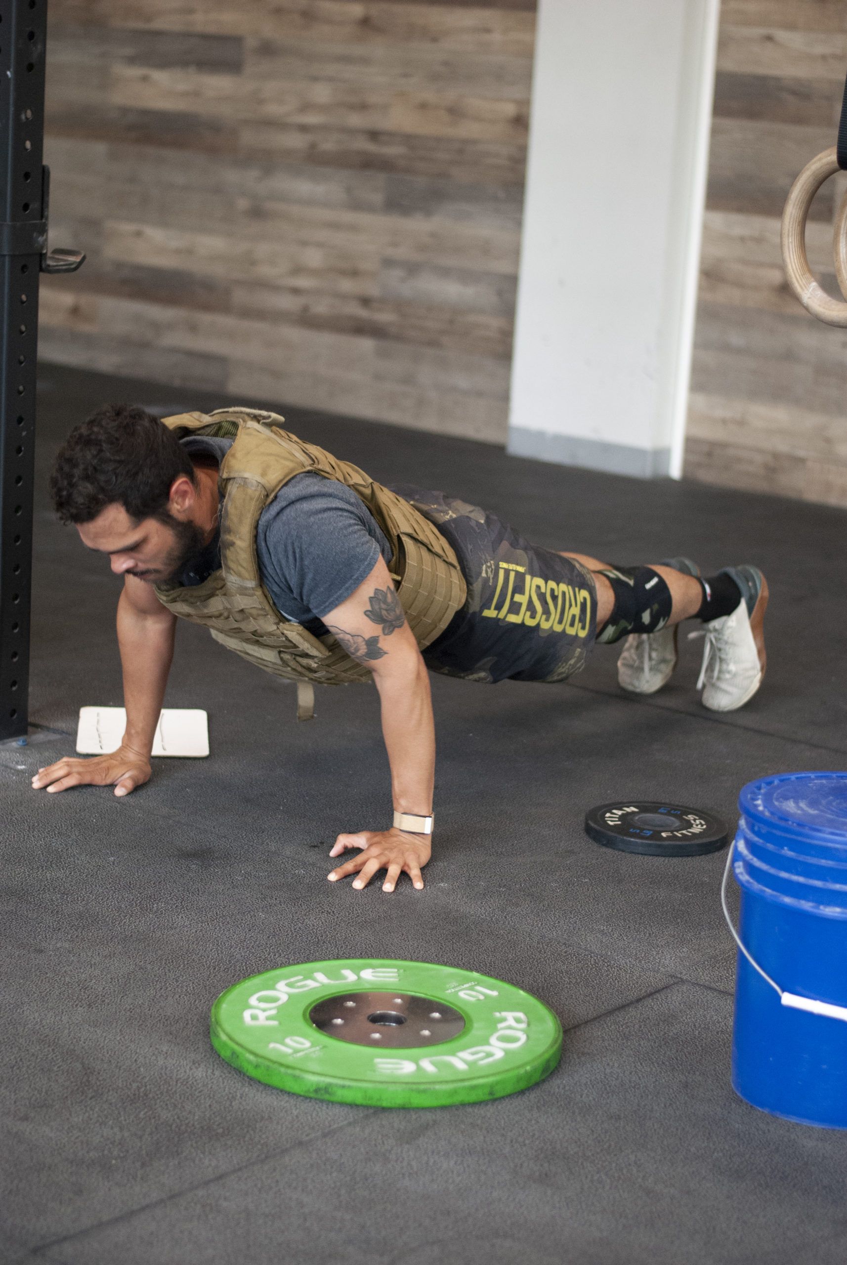 Coach Cristian doing push ups with weight vest 