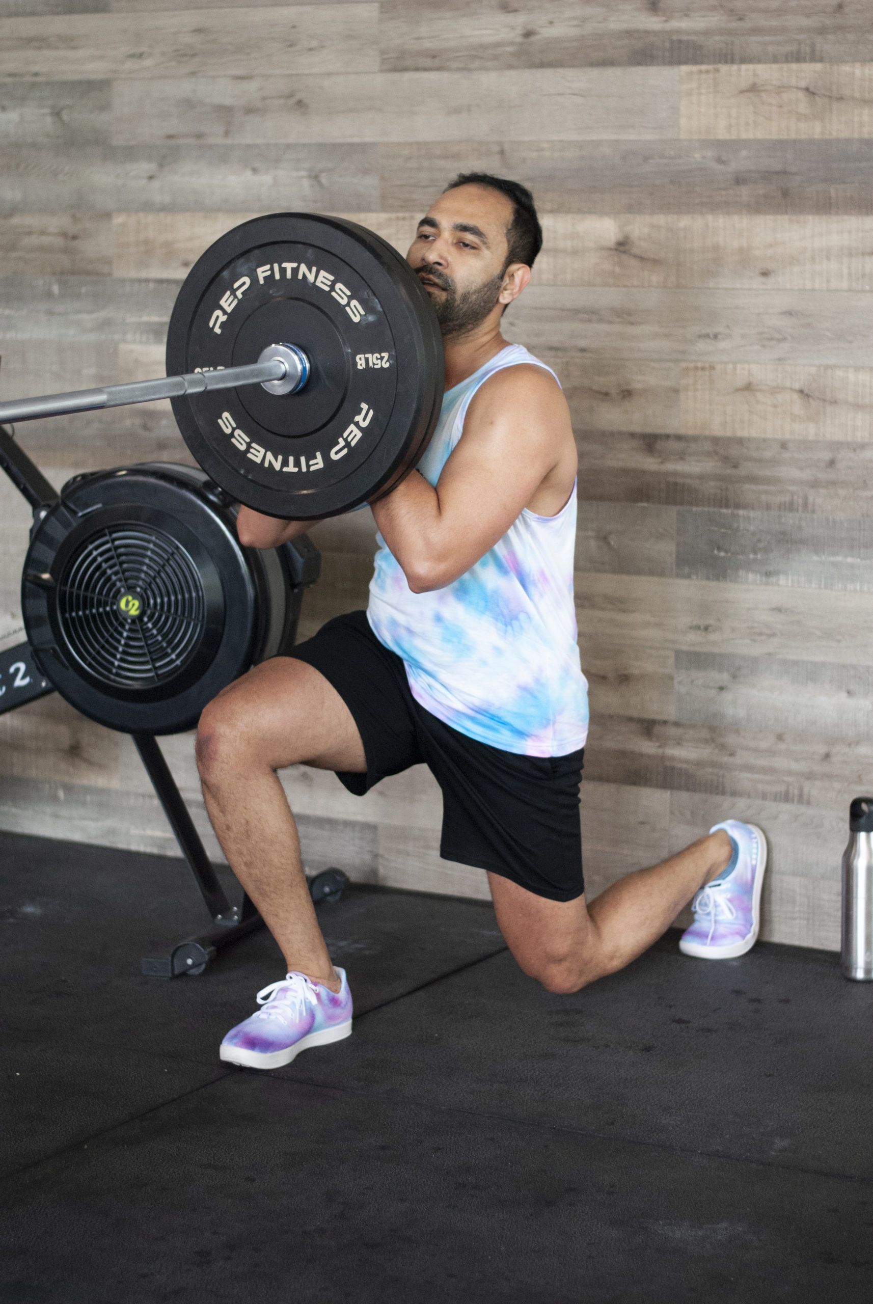 Rajiv lifting a barbell in partner challenge