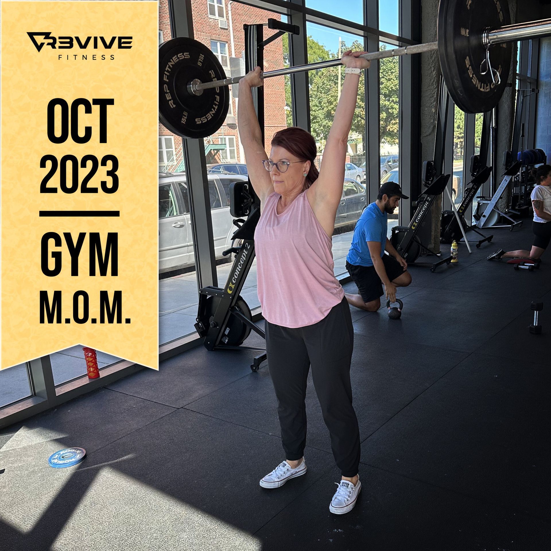 Woman lifting barbell at gym, labeled