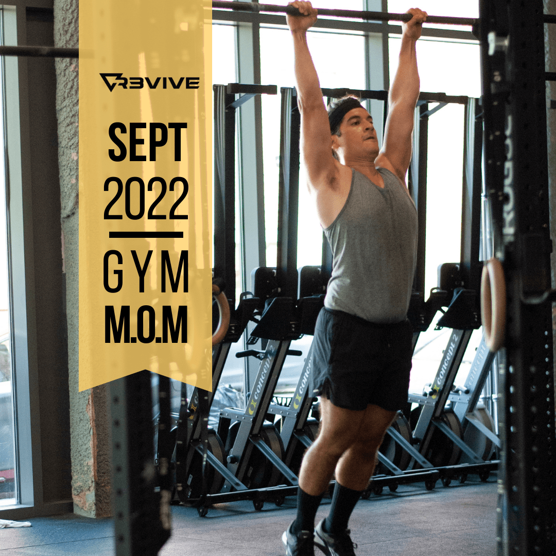 A person doing a pull-up in a gym setting. Text reads