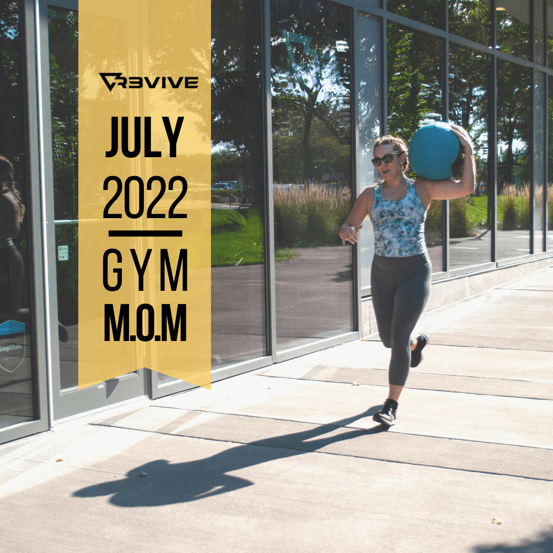 Woman running outside, holding medicine ball.