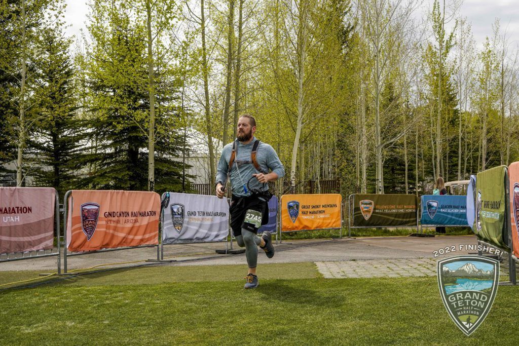 Derek running towards finish line