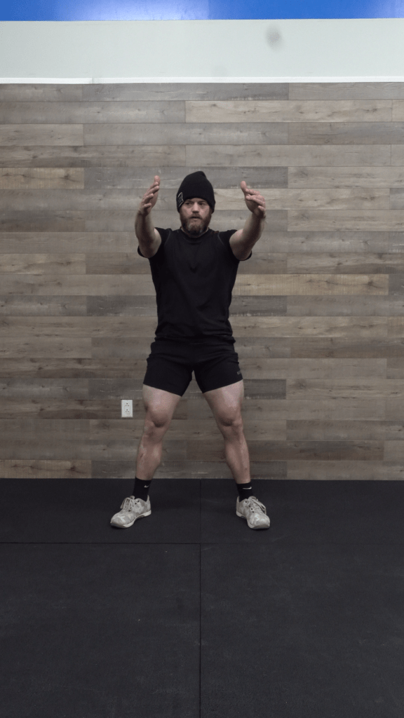 Starting position for the squat. feet shoulder width, head and eyes forward.