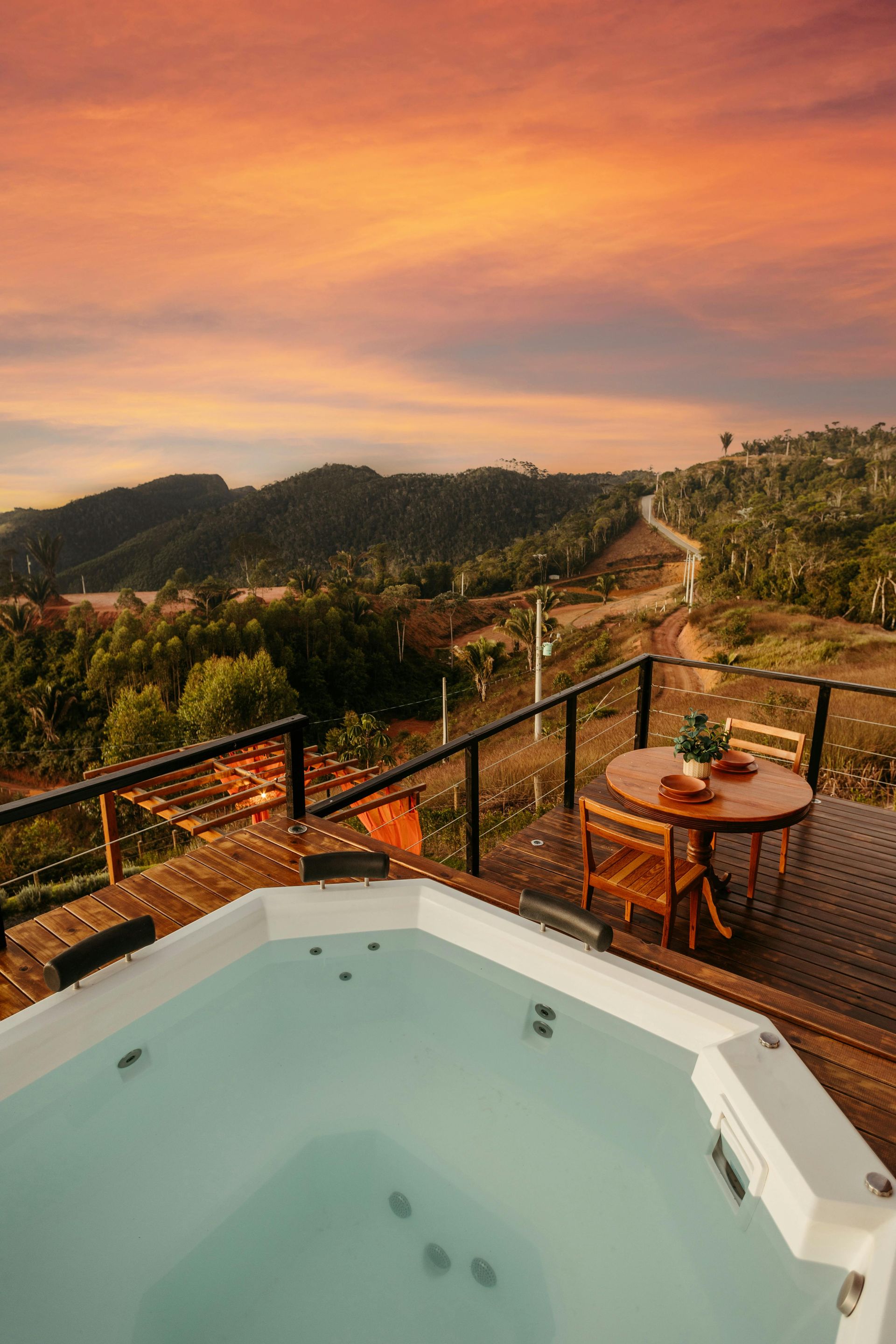 Stainless steel railings elegantly frame the pristine pool, creating a modern and sophisticated contrast.