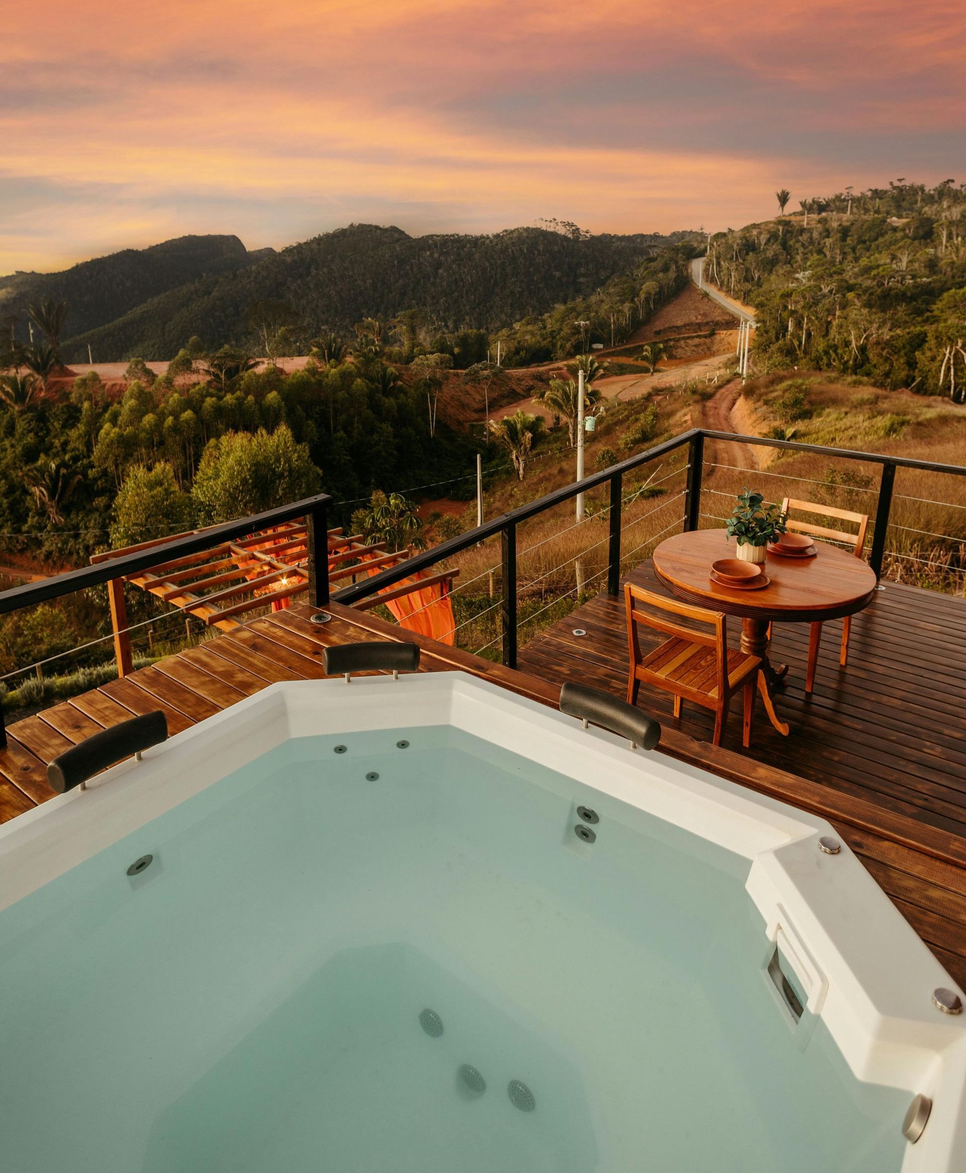Stainless steel railings elegantly frame the pristine pool, creating a modern and sophisticated contrast.