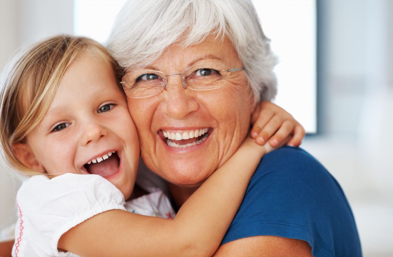 Child and grandparent happy with family dentist in Honolulu, HI