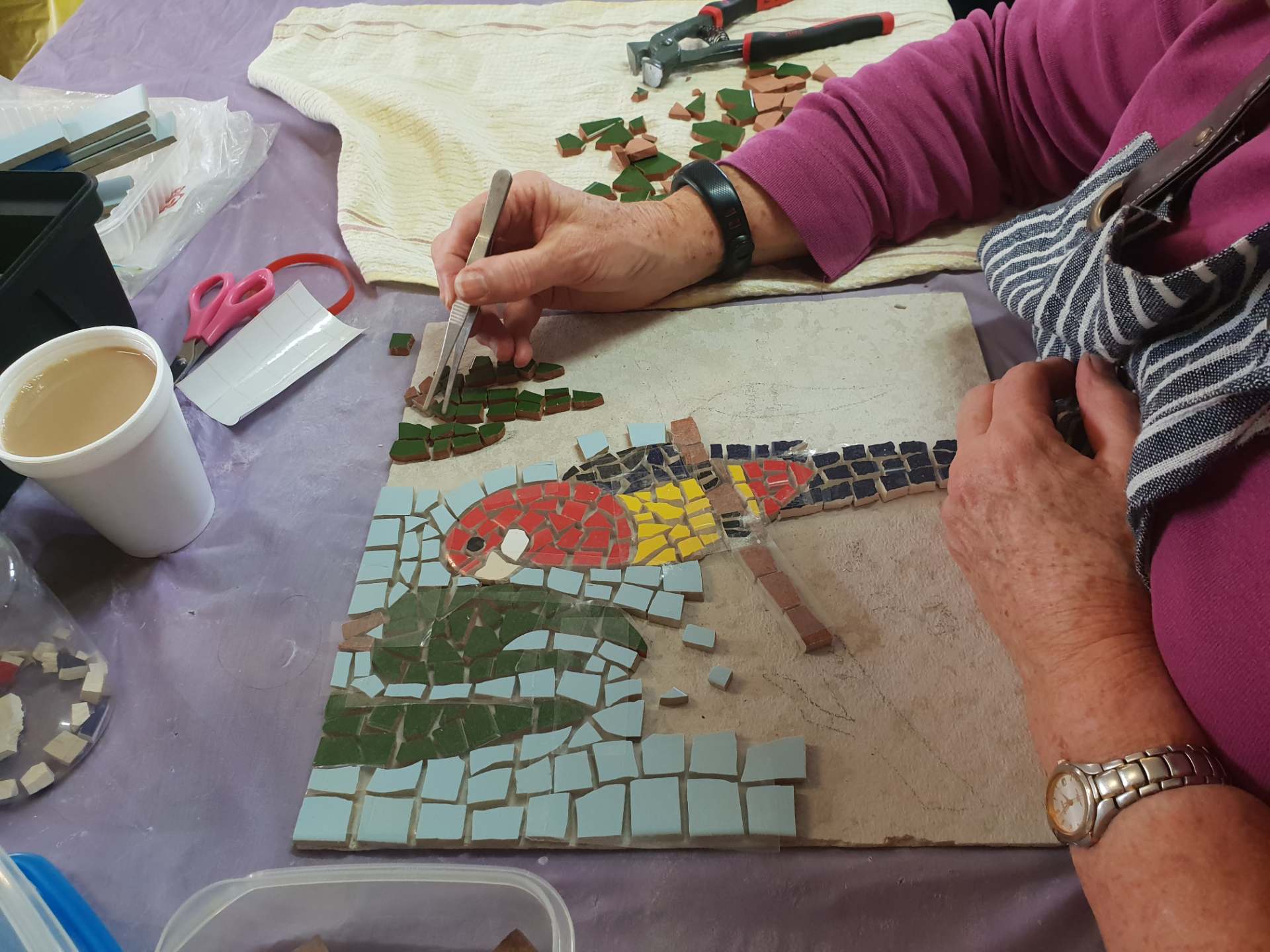 man joining colour stones