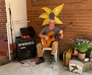 man playing a guitar