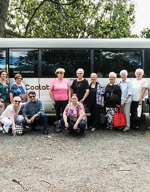 tourist standing by the bus