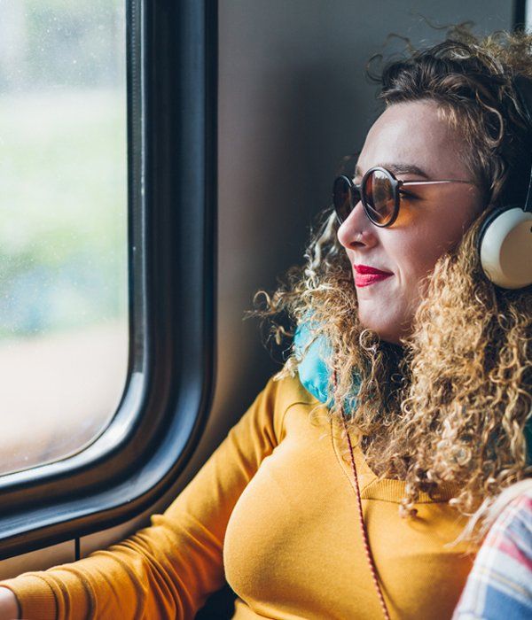 Happy Passenger — Lincoln, NE — OMALiNK Airport Shuttle Charter & Courier Service woman enjoying an airport charter in Omaha, NE