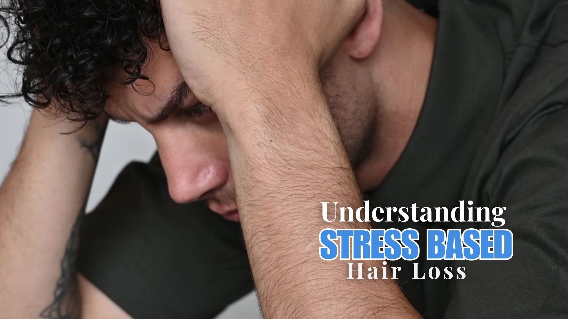 young man, head in hands, stressd