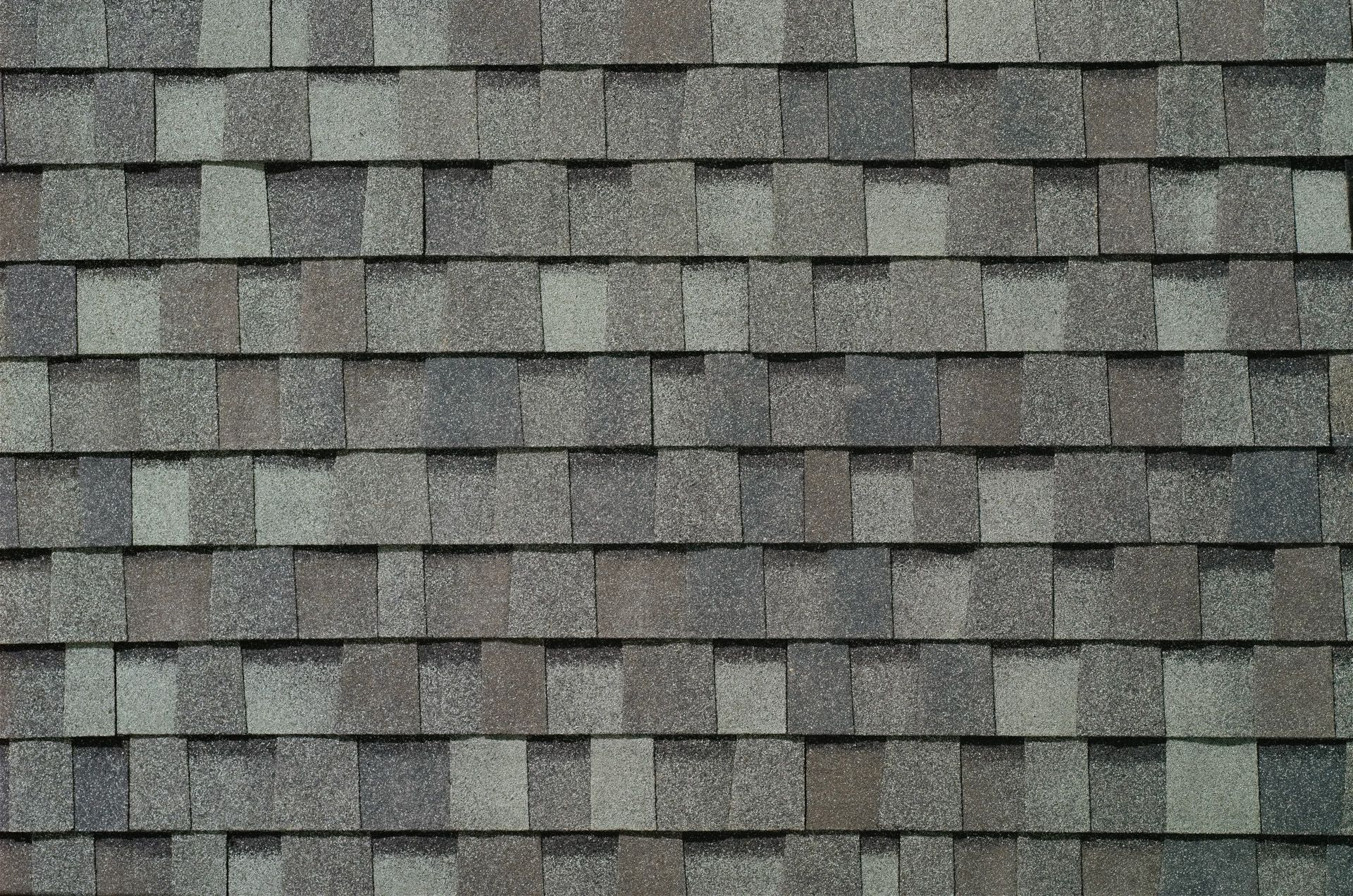 A close up of a roof with shingles on it.
