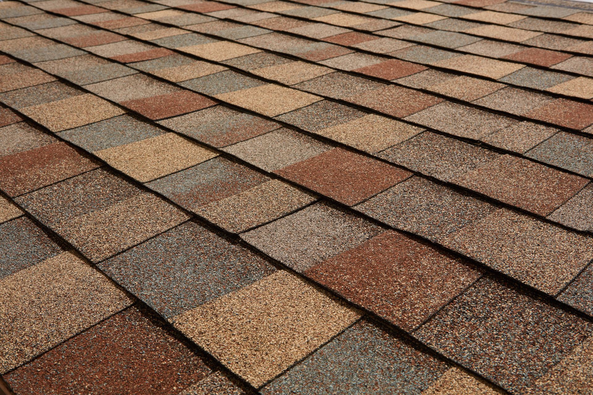 A close up of a roof with shingles on it
