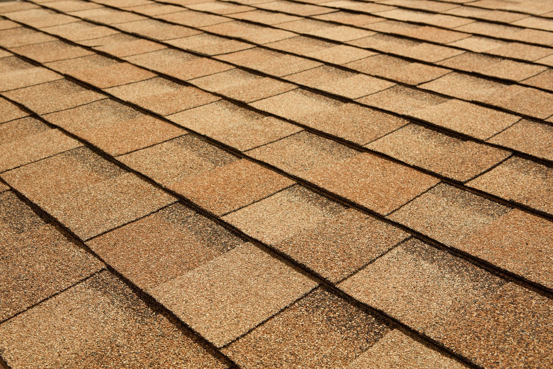 A close up of a roof with shingles on it.
