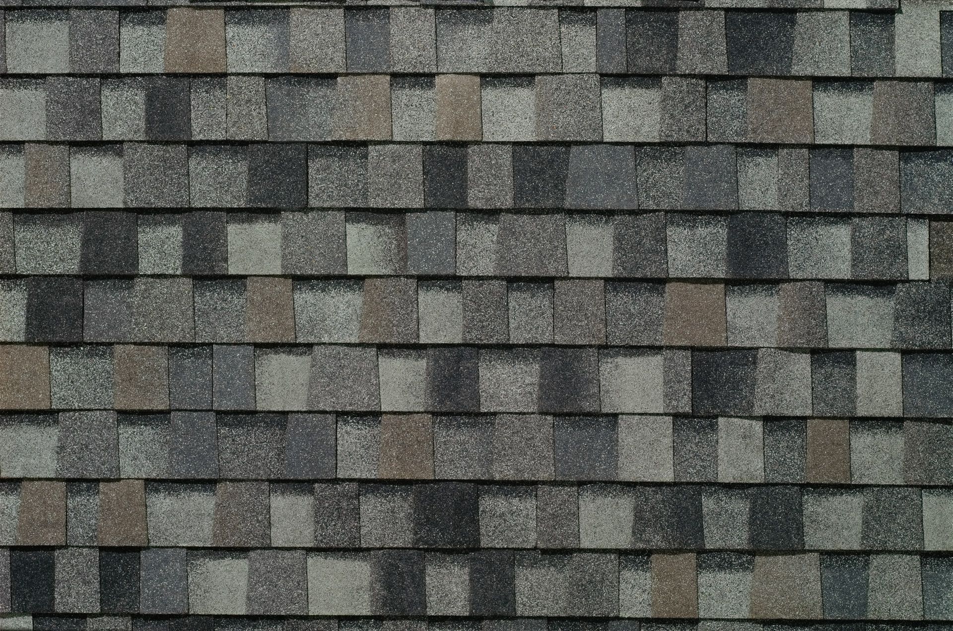A close up of a roof with shingles on it