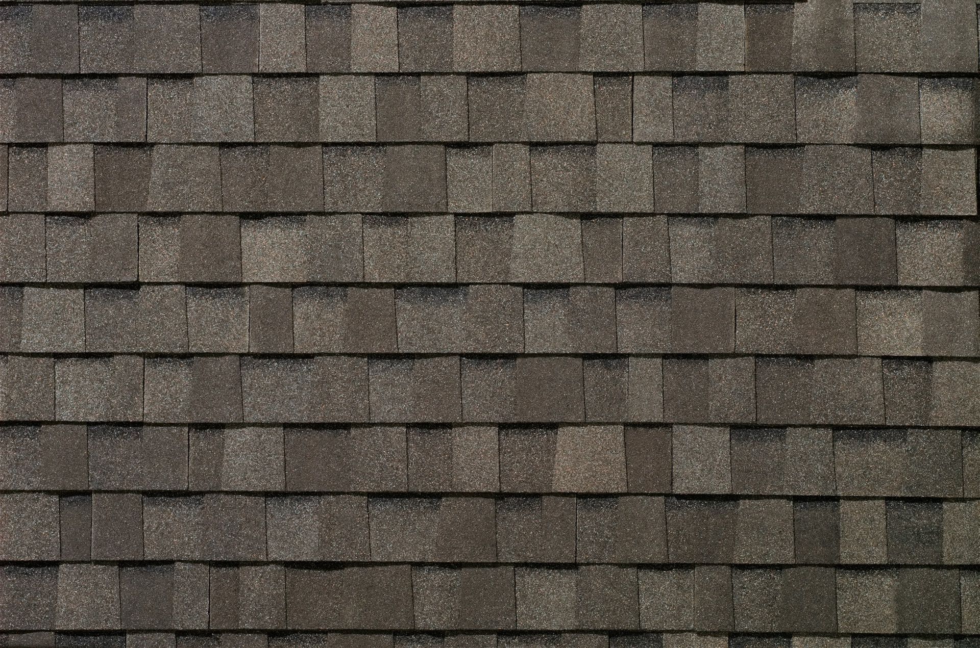 A close up of a roof with shingles on it