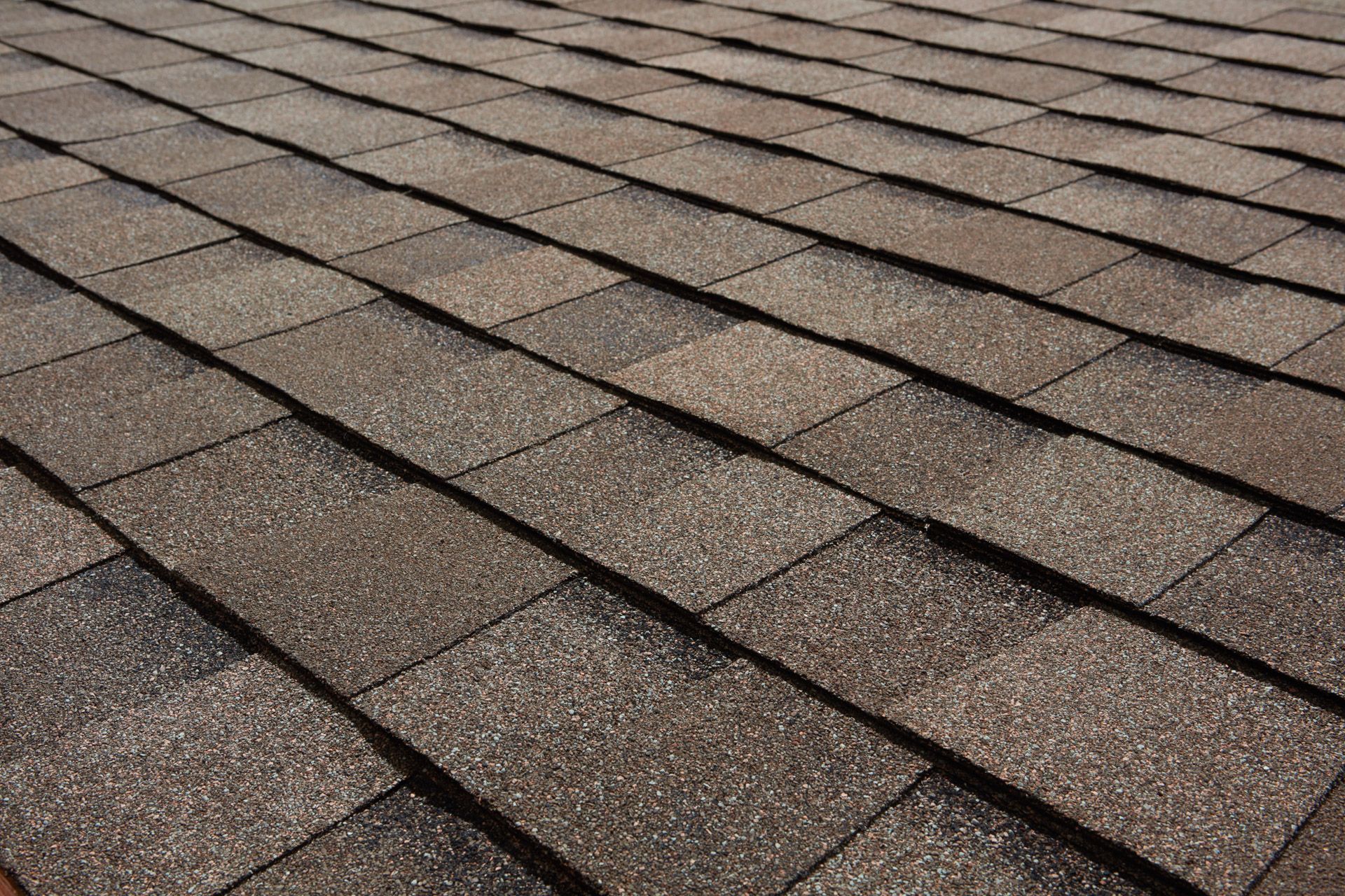 A close up of a roof with shingles on it