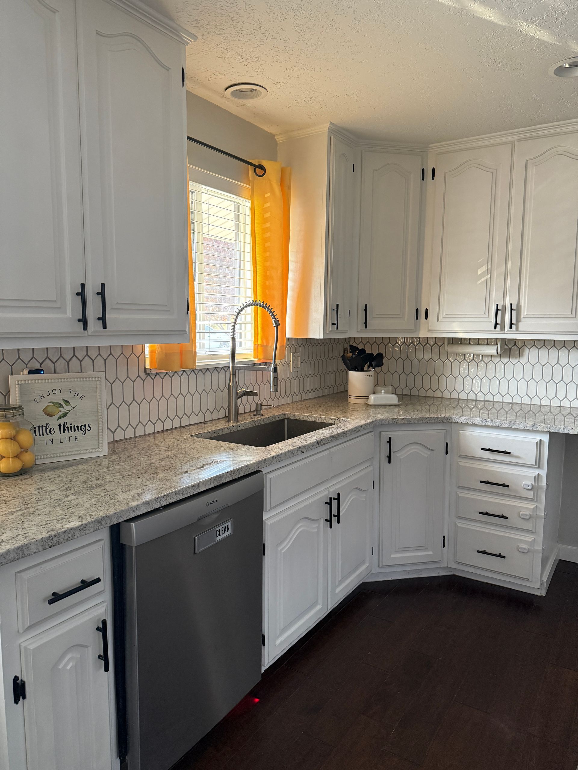 Installed new countertops, backsplash and window with this remodel 
