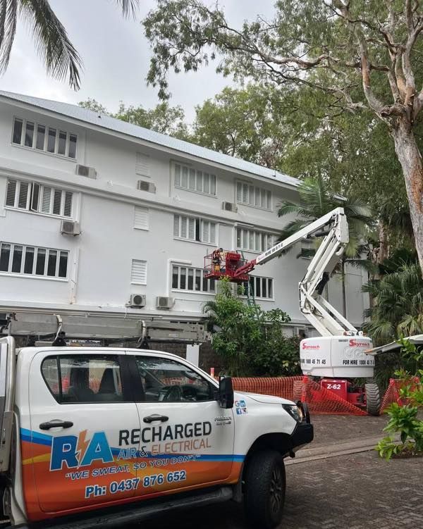 A Recharged Truck Is Parked in Front of A Building — Recharged Air & Electrical in Port Douglas, QLD
