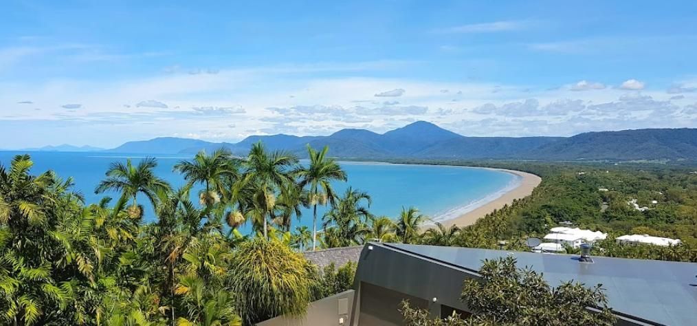 A View of A Beach with Mountains — Recharged Air & Electrical in Port Douglas, QLD