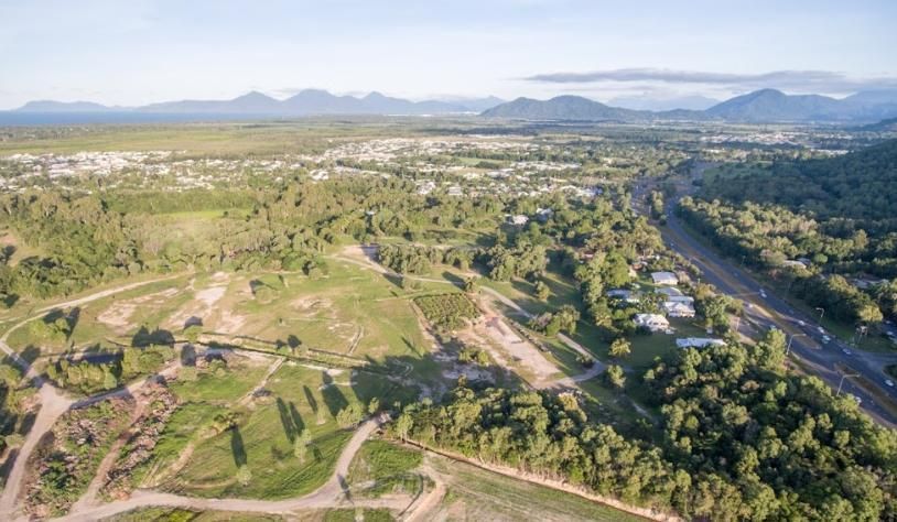 An Aerial View of A Lush Green Forest with Mountains in The Background — Recharged Air & Electrical in Smithfield, QLD