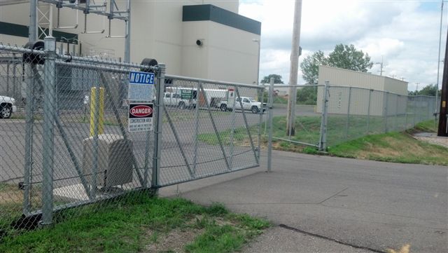 A fence with a sign on it that says danger