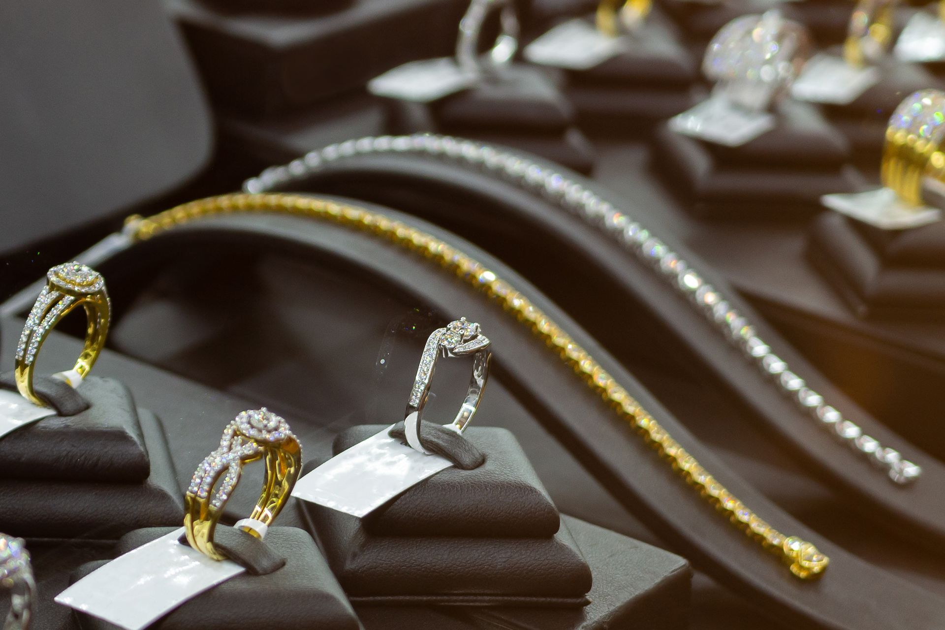 Diamond rings in retail windows highlighting diamond bridal jewelry, elegantly presented.