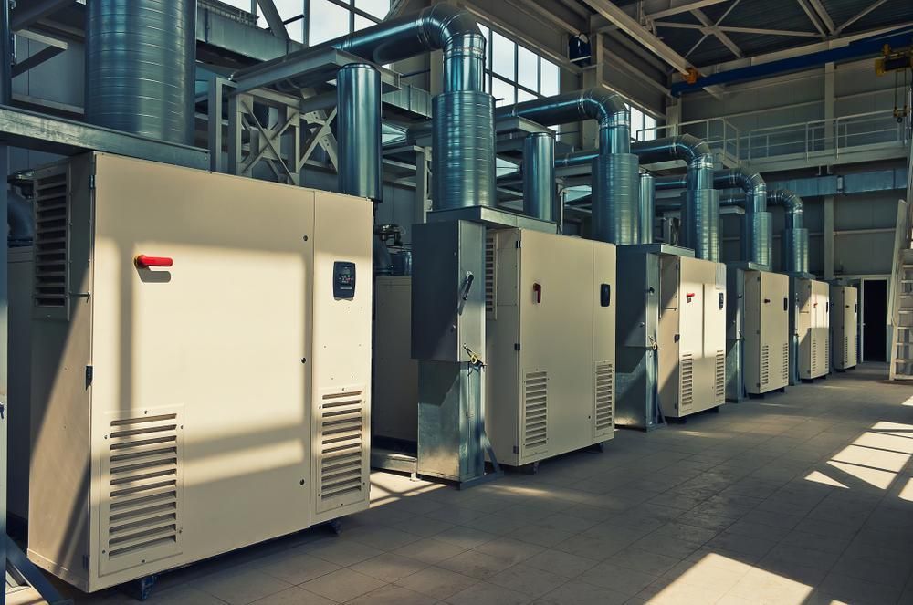 A Row of Machinery is Lined Up in a Factory — The Cool Guys In Humpty Doo, NT